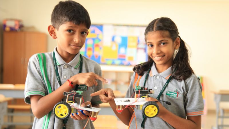 children-at-school-prepared-small-robot-cars