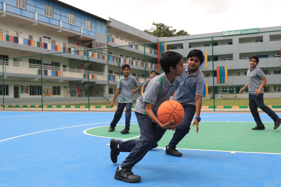 student-playing-basketball